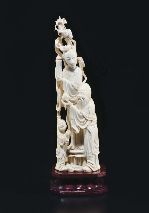 A carved ivory Guanyin, Shoulao and child group, China, early 20th century