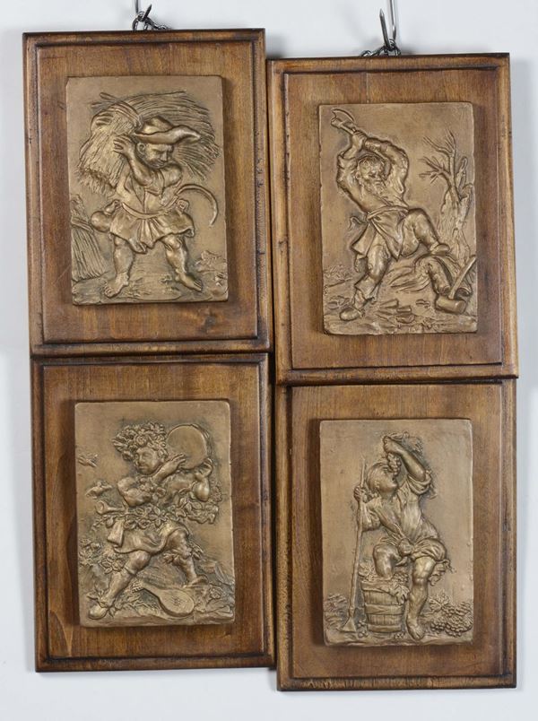 Quattro formelle in terracotta raffiguranti le quattro stagioni