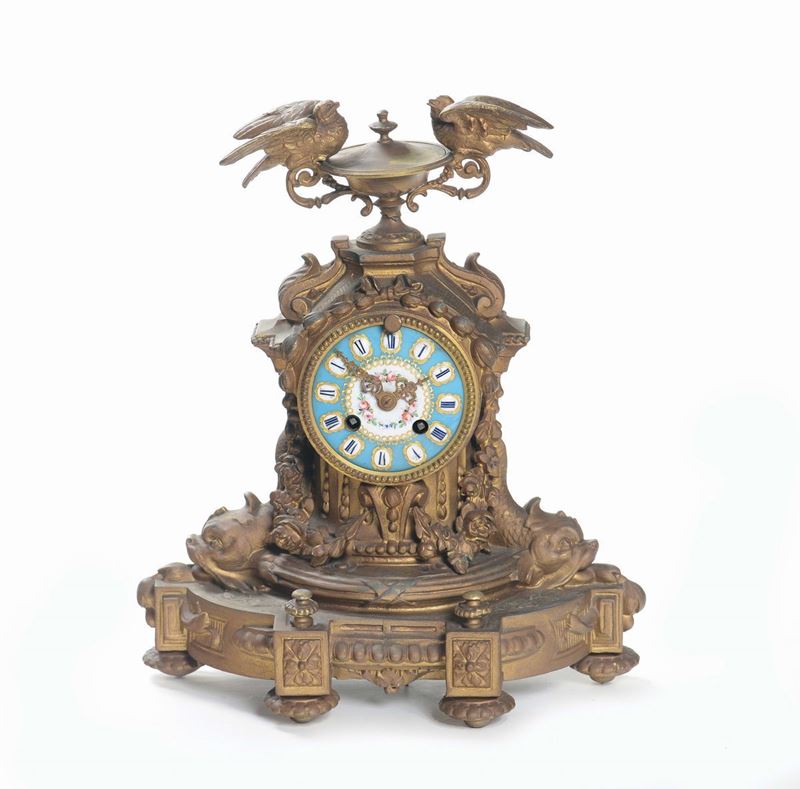 Orologio in metallo dorato, Francia XIX-XX secolo  - Asta Arredi dalle dimore degli eredi Ercole Marelli e altre provenienze - Cambi Casa d'Aste