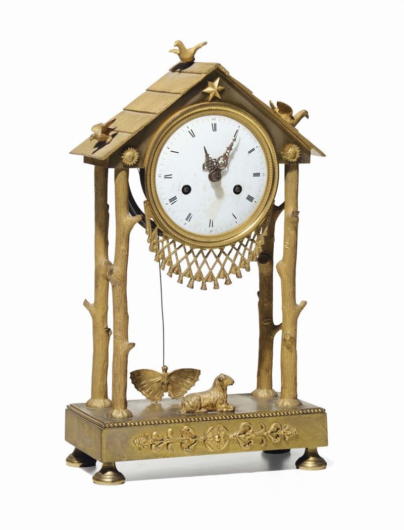 Orologio Impero in bronzo dorato. Francia 1810 circa  - Asta Arredi dalle dimore degli eredi Ercole Marelli e altre provenienze - Cambi Casa d'Aste