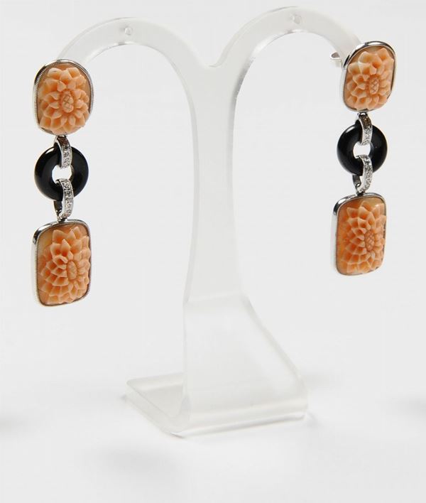 A pair of coral, onix and diamond pendent earrings