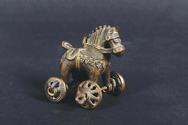 A small bronze horse with wheels, Persia, 20th century
