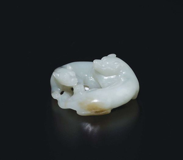 A small white and russet jade two dogs group, China, Qing Dynasty, 18th century