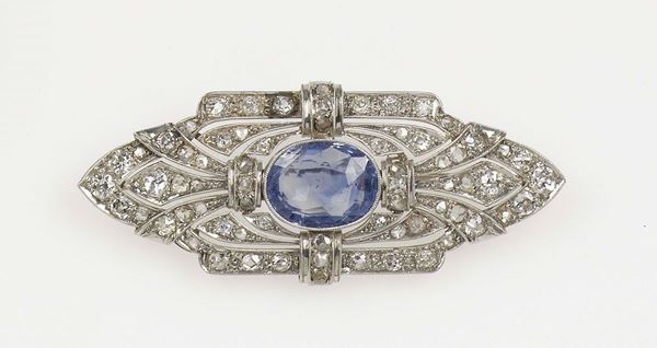 A sapphire and diamond brooch. Mounted in platinum. Used