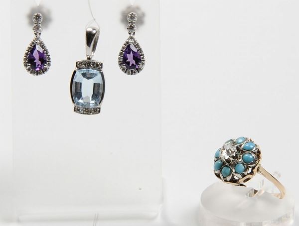 A tourquoise and old cut diamond ring, a pair of amethyst and diamond earrings, a blue topaz and diamond pendant