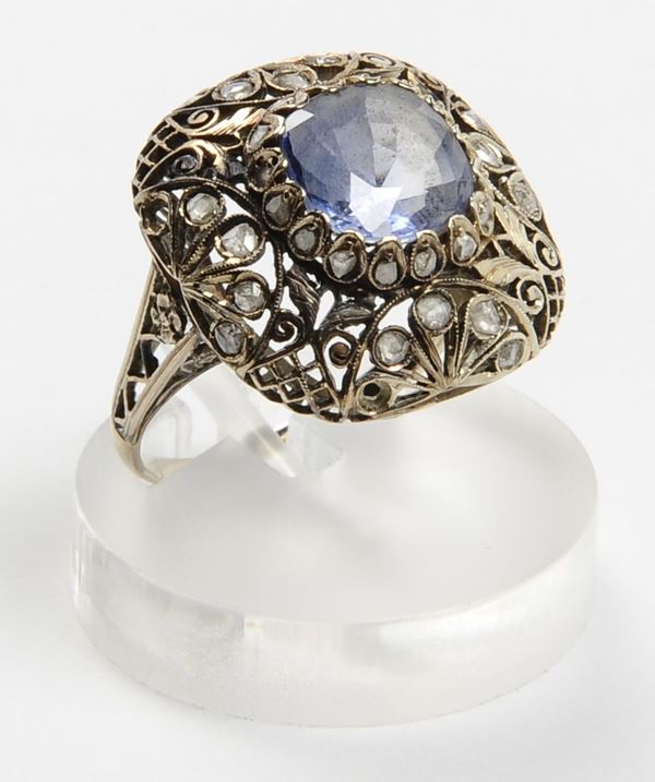A sapphire and rose cut diamond ring