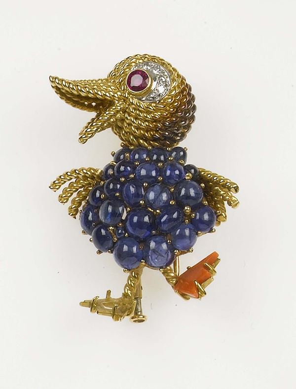 A cabochon sapphire, ruby, coral and diamond brooch