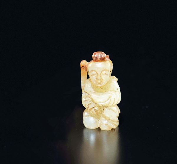 A small white and russet jade figure of praying child with cup, China, Qing Dynasty, 19th century