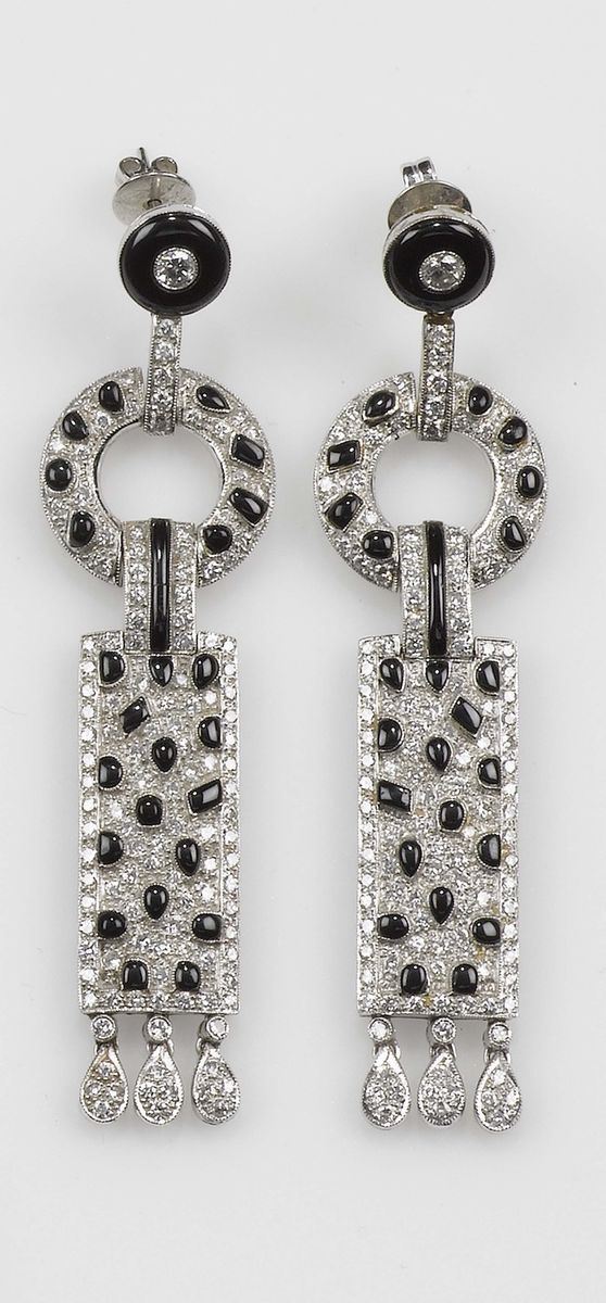 A diamond and black enamel pandant earrings. Mounted in white gold 750/1000