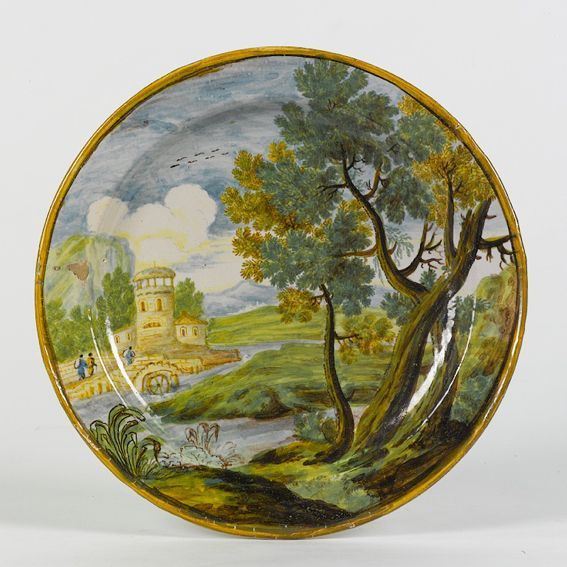 Piatto in maiolica policroma raffigurante paesaggio con fiume, Castelli XVIII secolo