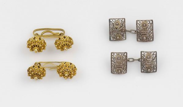 A lot containing two pairs of cufflinks. A gold and silverfiligree