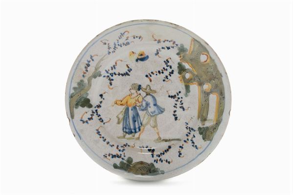 Piattino in maiolica con decoro a “figurette e rovine”,  Savona XVIII secolo
