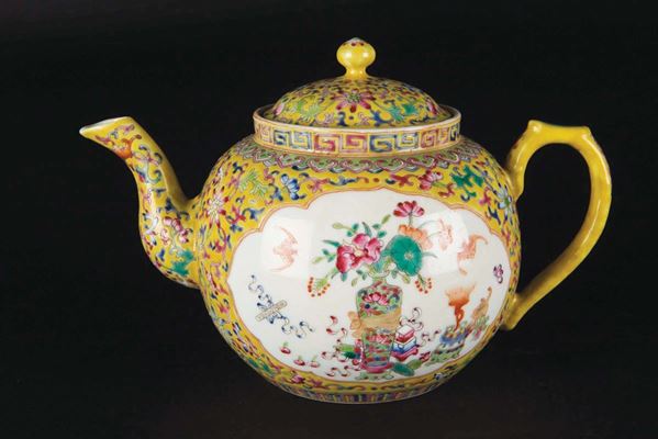 A yellow-ground porcelain teapot with naturalistic decoration within reserves, China, 20th century