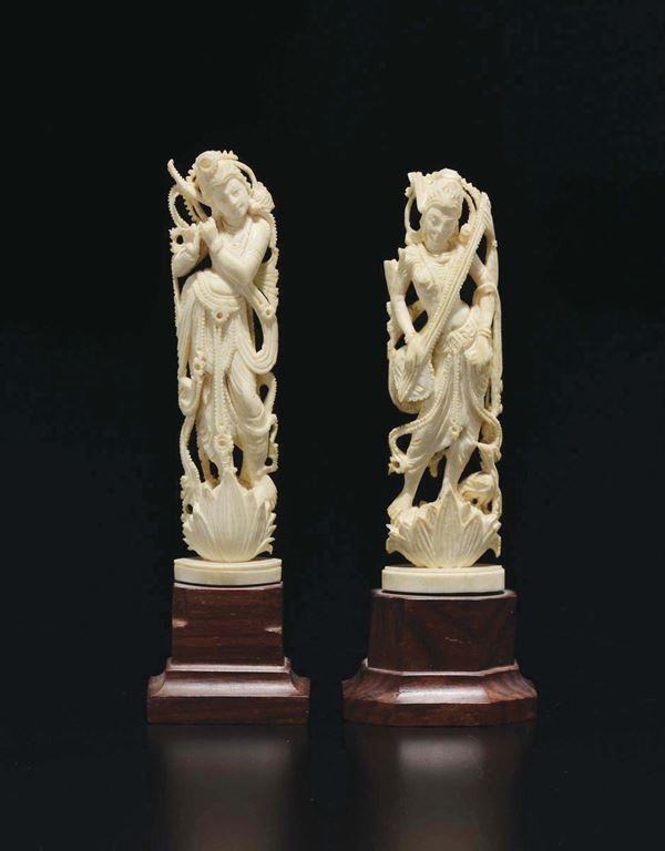 Two carved ivory deities, India, early 20th century