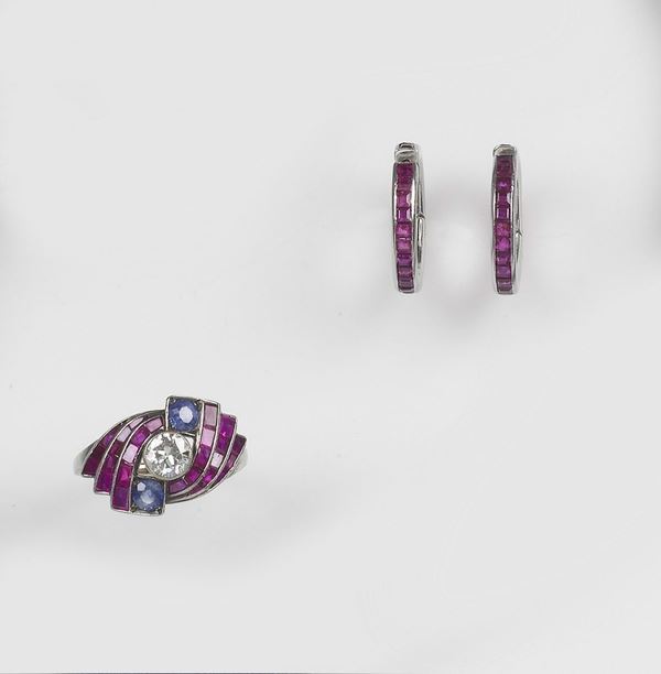 A parure composed of ruby, sapphire and diamond earrings and ring. Mounted in white gold 750/1000
