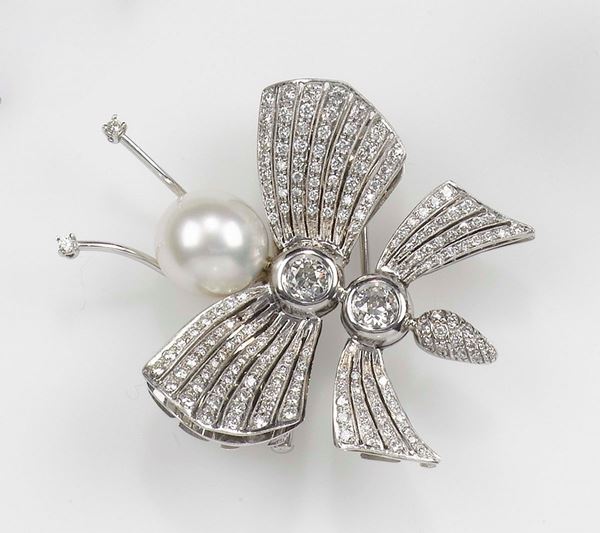 A butterfly pearl and diamond clip. Mounted in white gold 750/1000