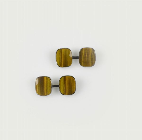 A pair of gold and tiger's-eye cufflinks