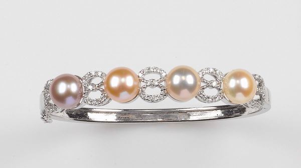 A pearl and diamond bangle