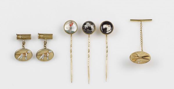 A lot containing four tie brooches and one couple of enamel, crystal and diamond cufflinks