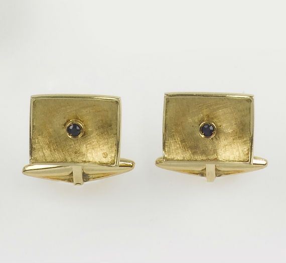 A pair of gold and sapphire cufflinks