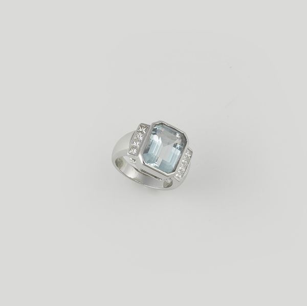 An acquamarine and diamond ring