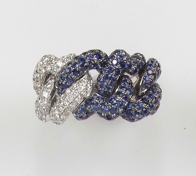 A diamond and sapphire gourmette ring. The pavé-set diamonds and sapphires are mounted in white gold 750/1000  - Auction Fine Jewels - Cambi Casa d'Aste