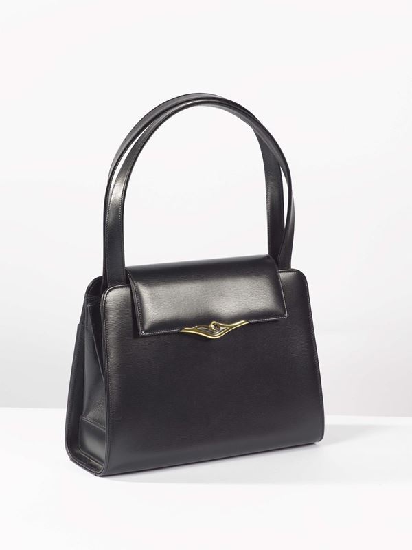 S de Cartier, a women's leather purse