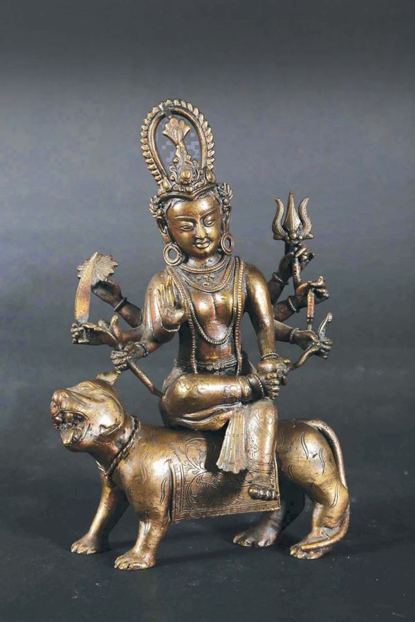 A bronze figure of goddess on a Pho dog, China, 20th century