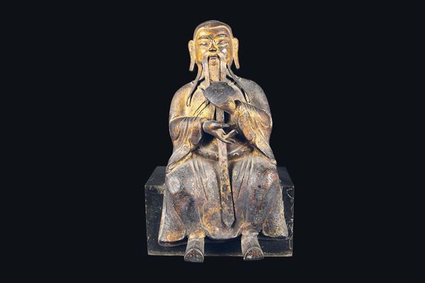 A semi-gilt bronze figure of dignitary with ruyi, China, Ming Dynasty, 17th century