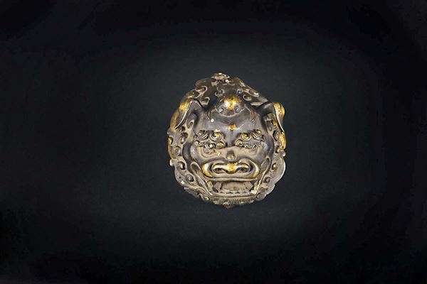 A semi-gilt bronze Pho dog's head, China, Ming Dynasty, 17th century