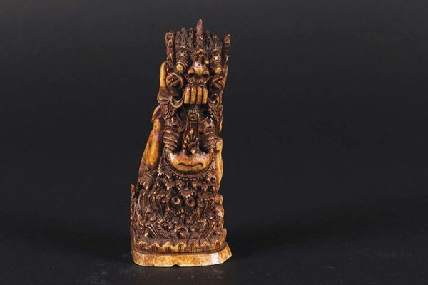 A small carved ivory figure of demon, China, early 20th century