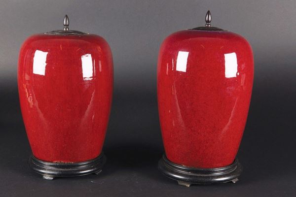 Two monochrome red-glazed potiches and wooden cover, China, Qing Dynasty, 19th century