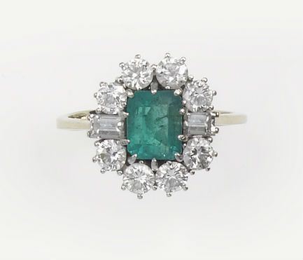 An emerald and diamonds cluster ring