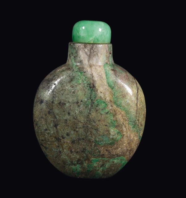 A green and russet jade snuff bottle, China, Qing Dynasty, 19th century