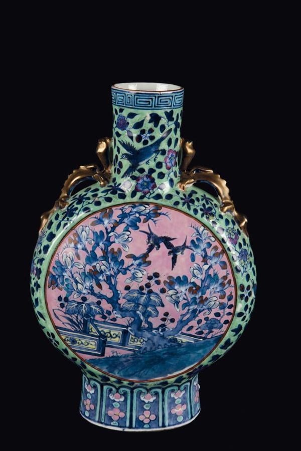 A polychrome enamelled porcelain flask depicting birds and cherry blossoms within reserves, China, Qing Dynasty, 19th century