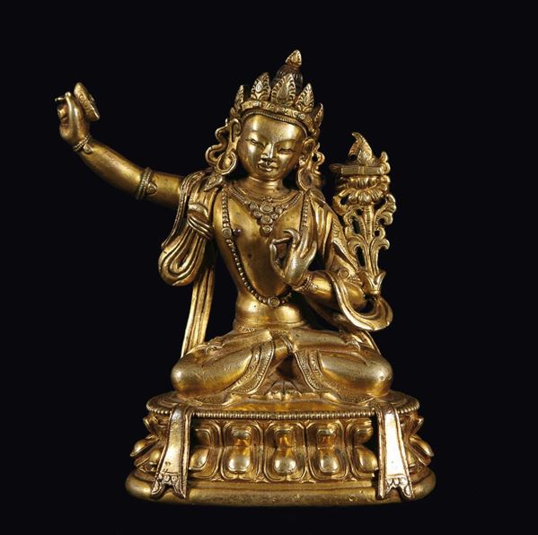 Figura di Manjusri in bronzo dorato su fiore di loto, Tibet, XVIII secolo