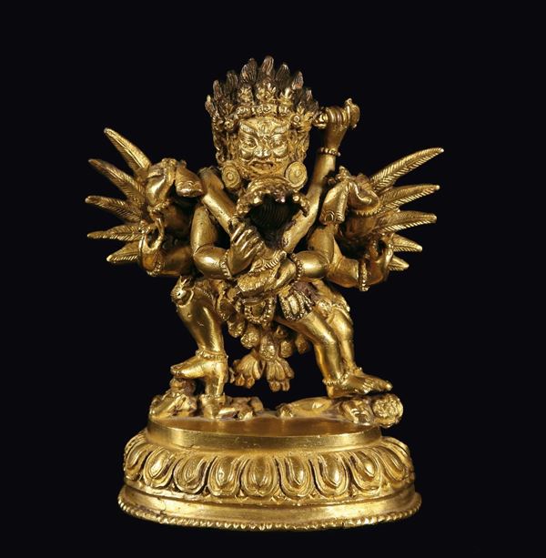A gilt bronze figure of Mahakala and wife, Tibet, 18th century
