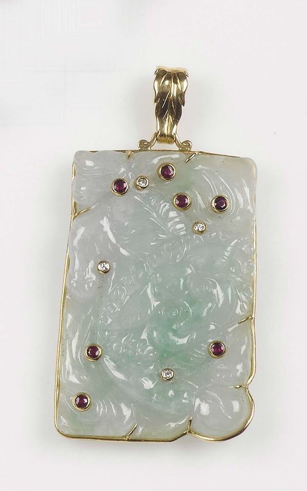A jadeite, ruby and diamond pendant. Mounted in yellow gold 750/1000