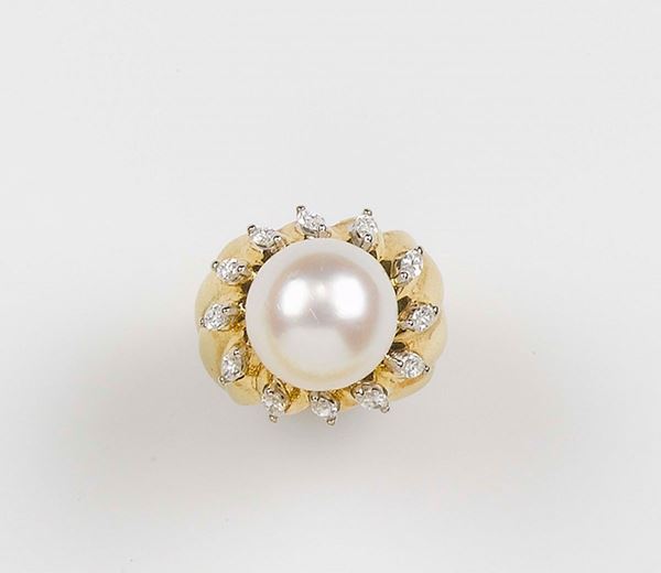 A pearl and navette-cut diamond ring
