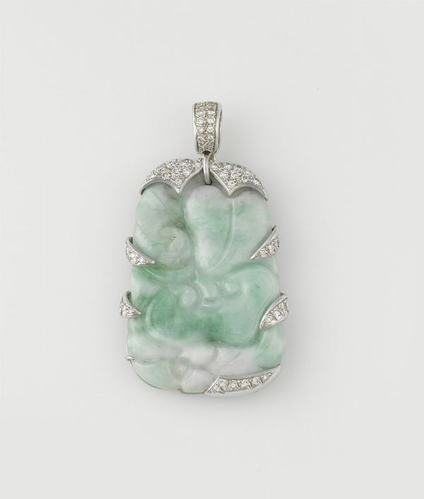 A jadeite and diamond pendant. Mounted in white gold 750/1000