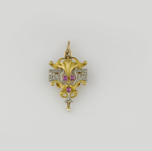 A diamond and ruby brooch/pendant