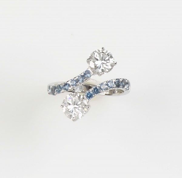 A diamond and sapphire ring. The two diamond total weight approx. 2,20 carats