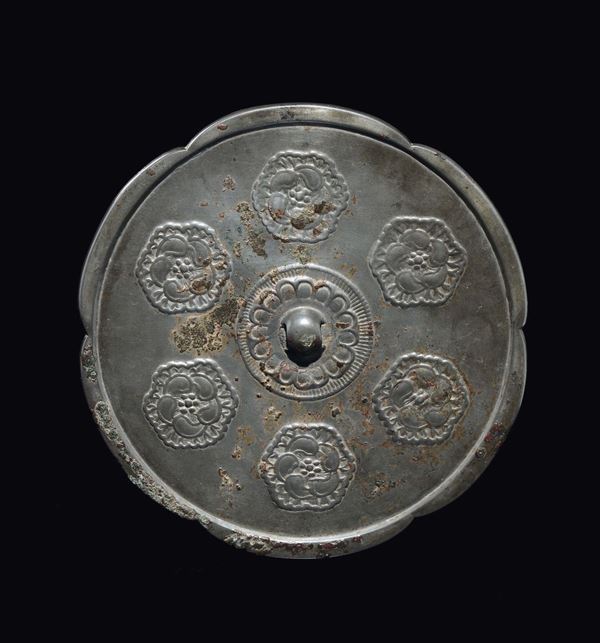A bronze mirror with central boss, China, Tang Dynasty (618-906)