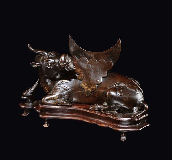 A bronze buffalo and moon mirror stand, China, Ming Dynasty, 17th century