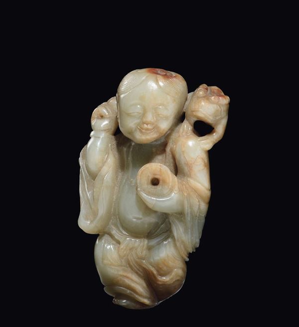 A white and russet jade child with Pi, China, Ming Dynasty, 17th century