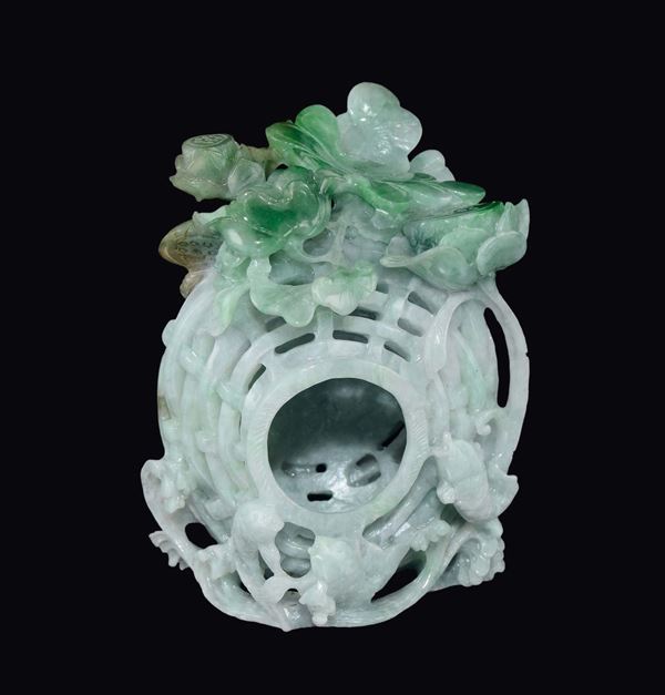 A jadeite brush bowl with fish and leaves in relief, China, 20th century
