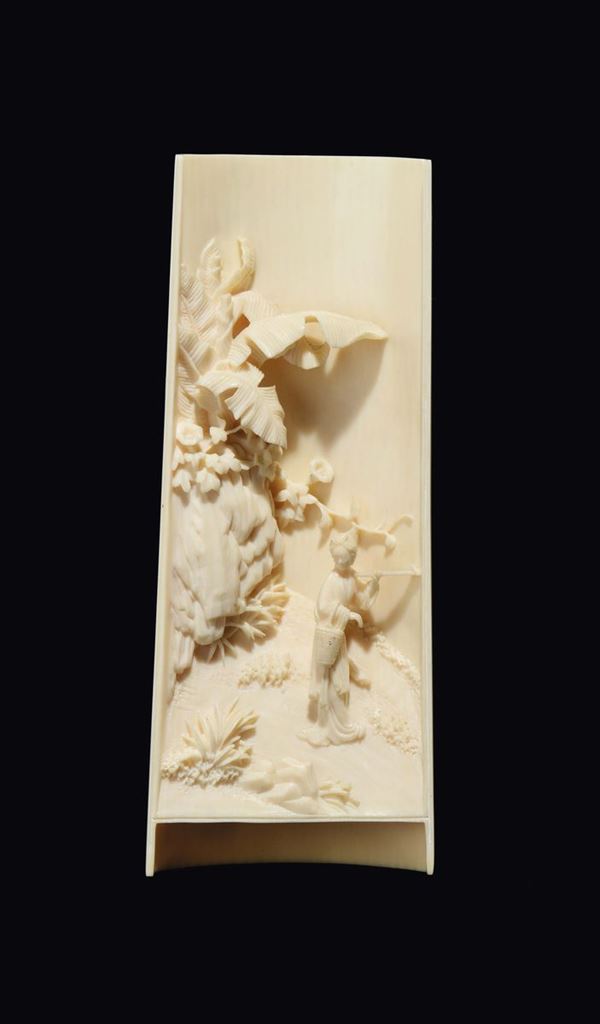 A carved ivory Guanyin within landscape plaque, China, Qing Dynasty, 19th century