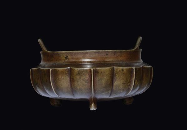 A tripod embossed bronze censer with handles, China, Ming Dynasty, 15th century