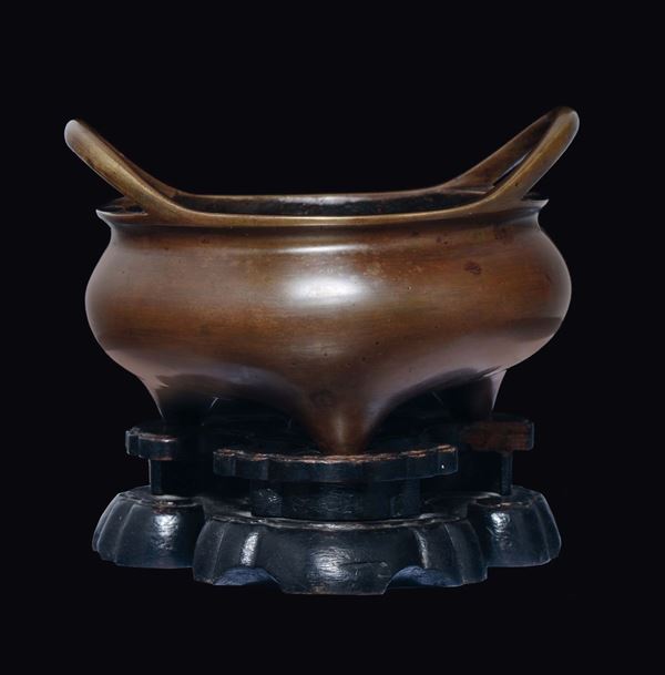 A bronze tripod two-handled censer, China, Ming Dynasty, 17th century