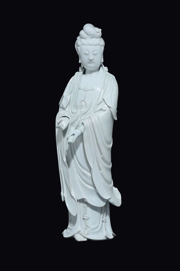 A Blanc de Chine Dehua figure of Guanyin with scroll, China, Qing Dynasty, 18th century